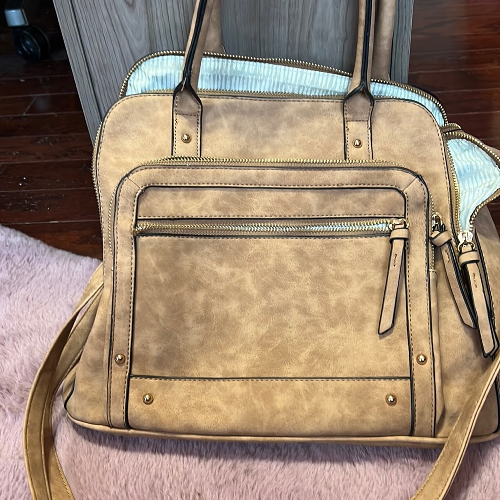 Very cute light brown purse from charming Charlie
